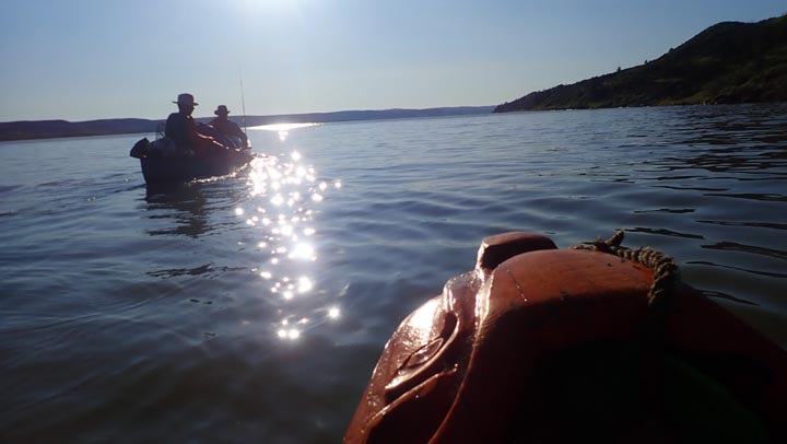 Paddling into the rising sun.