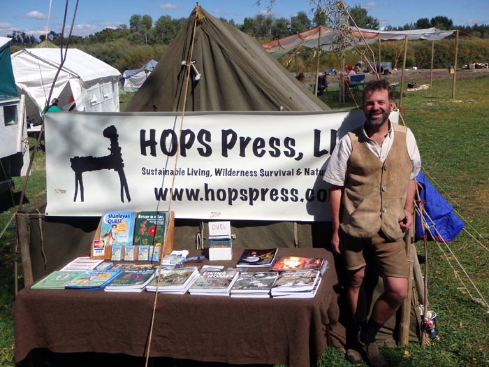 Tom Elpel selling books from his tent at Rabbistick.